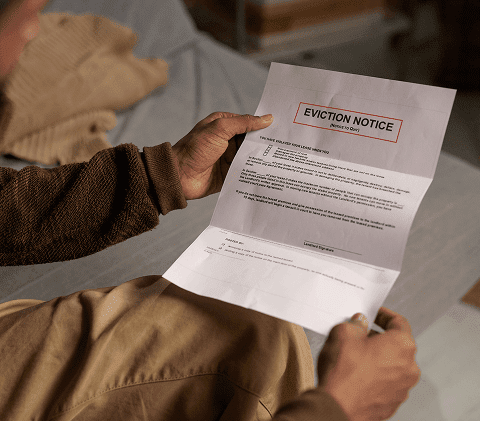 Person holding an eviction notice letter.
