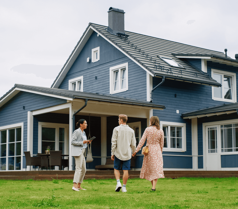 People viewing a modern blue house exterior.
